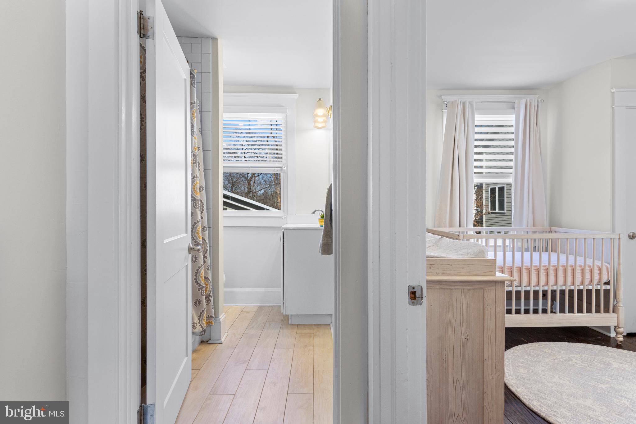 657 West End Walk Media, PA 19063 - Photo 16 of 26 a view of a bedroom with wooden floor and windows