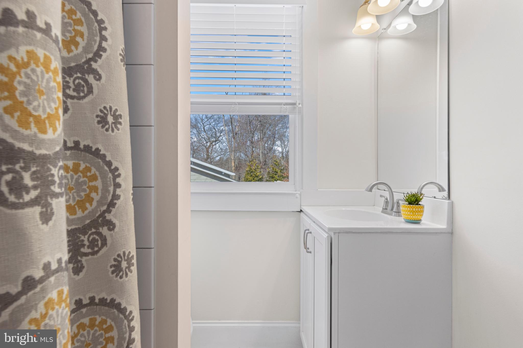 657 West End Walk Media, PA 19063 - Photo 18 of 26 a bathroom with a sink and a window