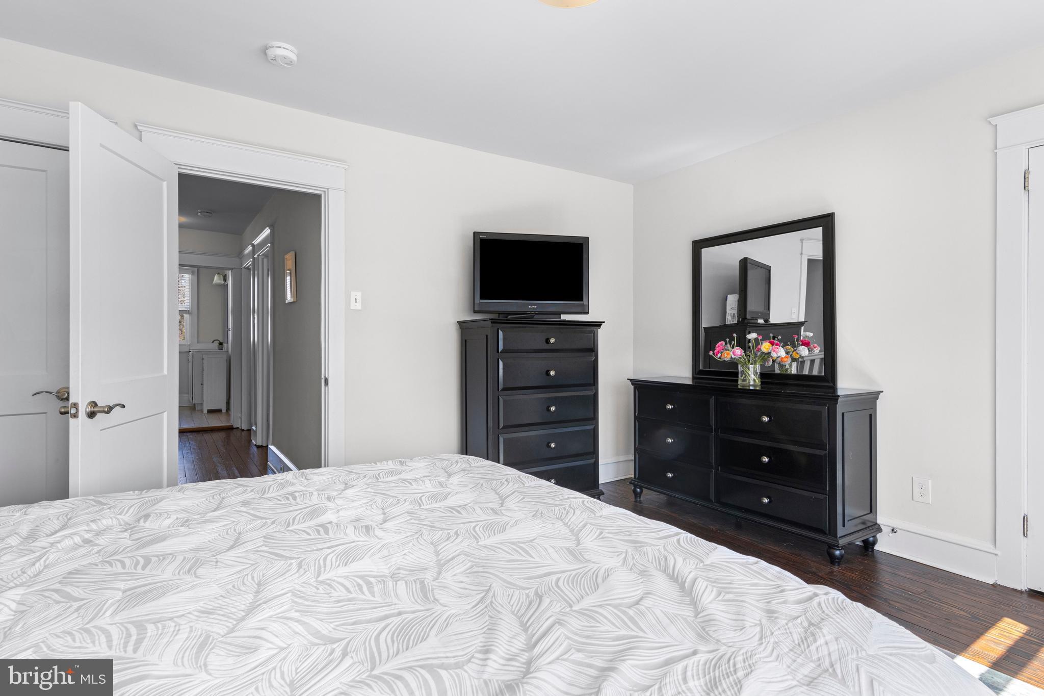 657 West End Walk Media, PA 19063 - Photo 25 of 26 a bedroom with a bed and a mirror on dresser