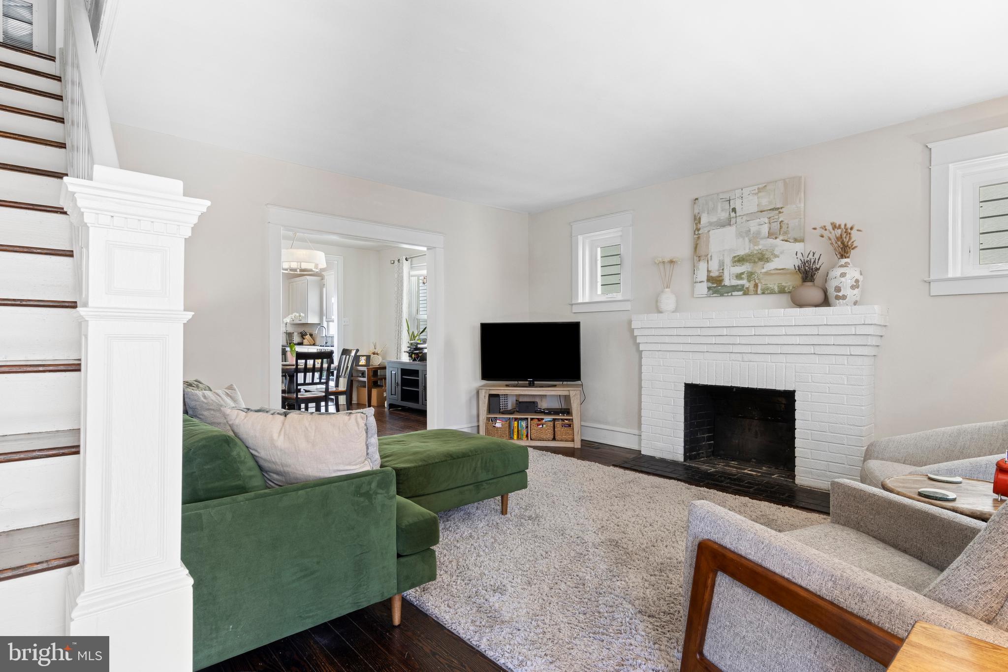 657 West End Walk Media, PA 19063 - Photo 5 of 26 a living room with furniture a flat screen tv and a fireplace