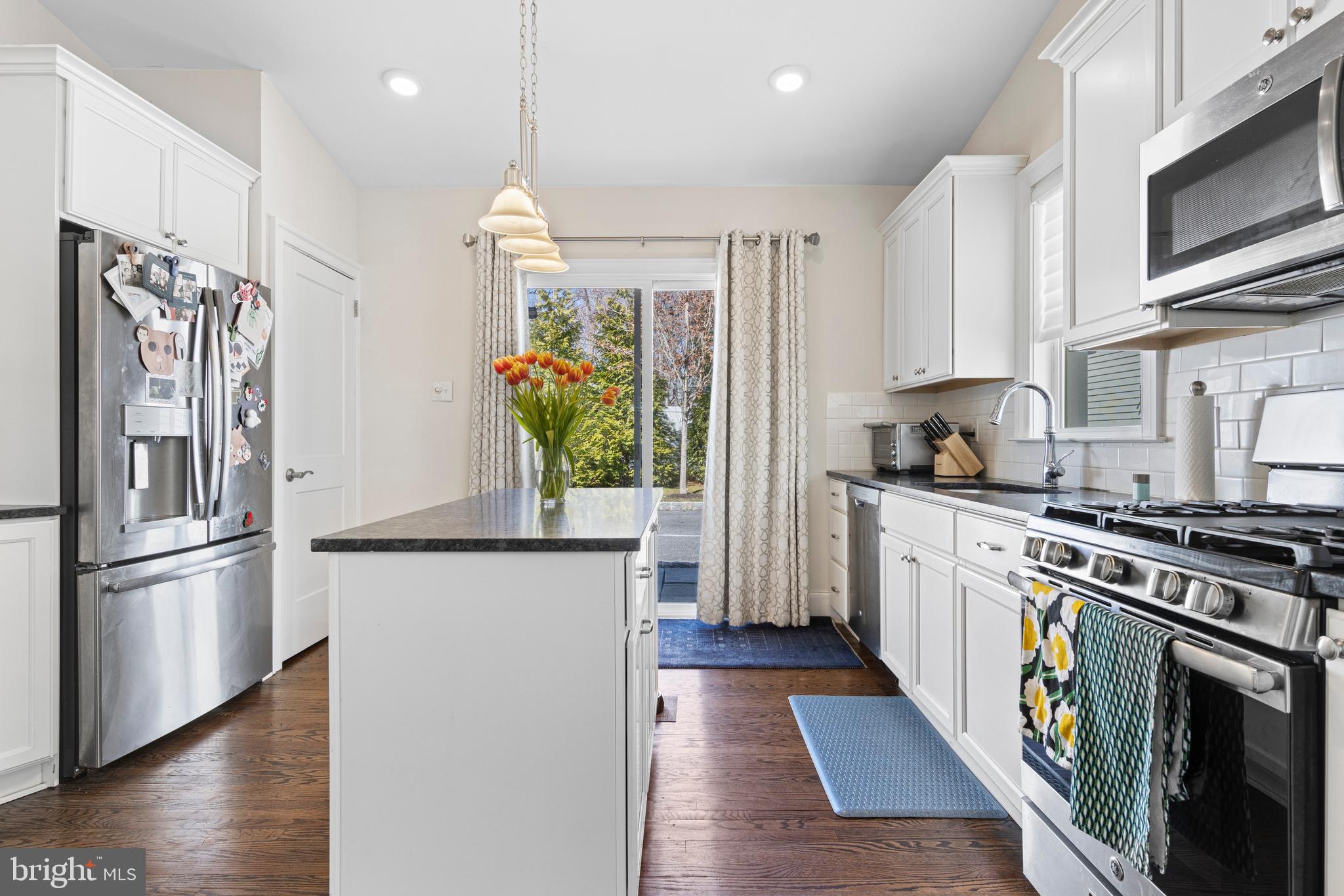 657 West End Walk Media, PA 19063 - Photo 10 of 26 a kitchen with stainless steel appliances a stove a sink and a refrigerator