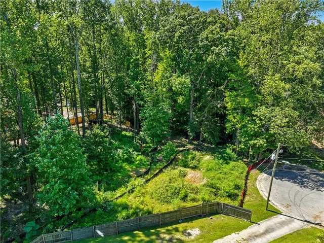 a view of yard from a swimming pool