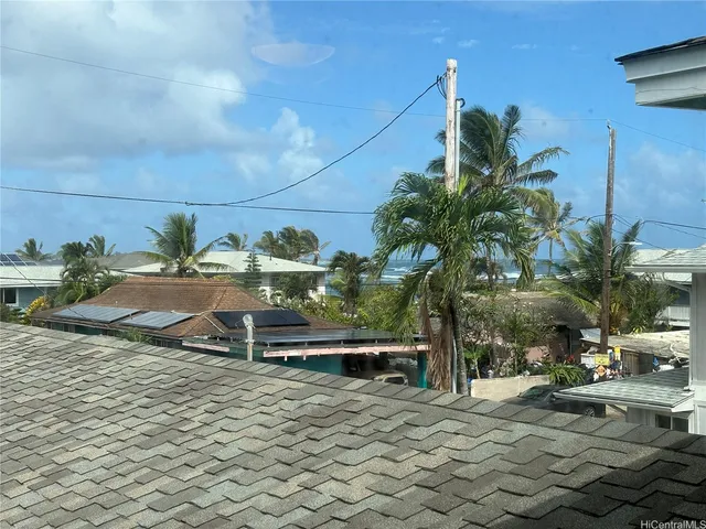 a terrace with outdoor seating and trees