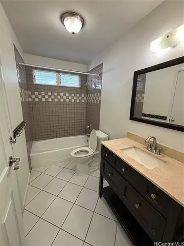 a bathroom with a double vanity sink mirror and toilet
