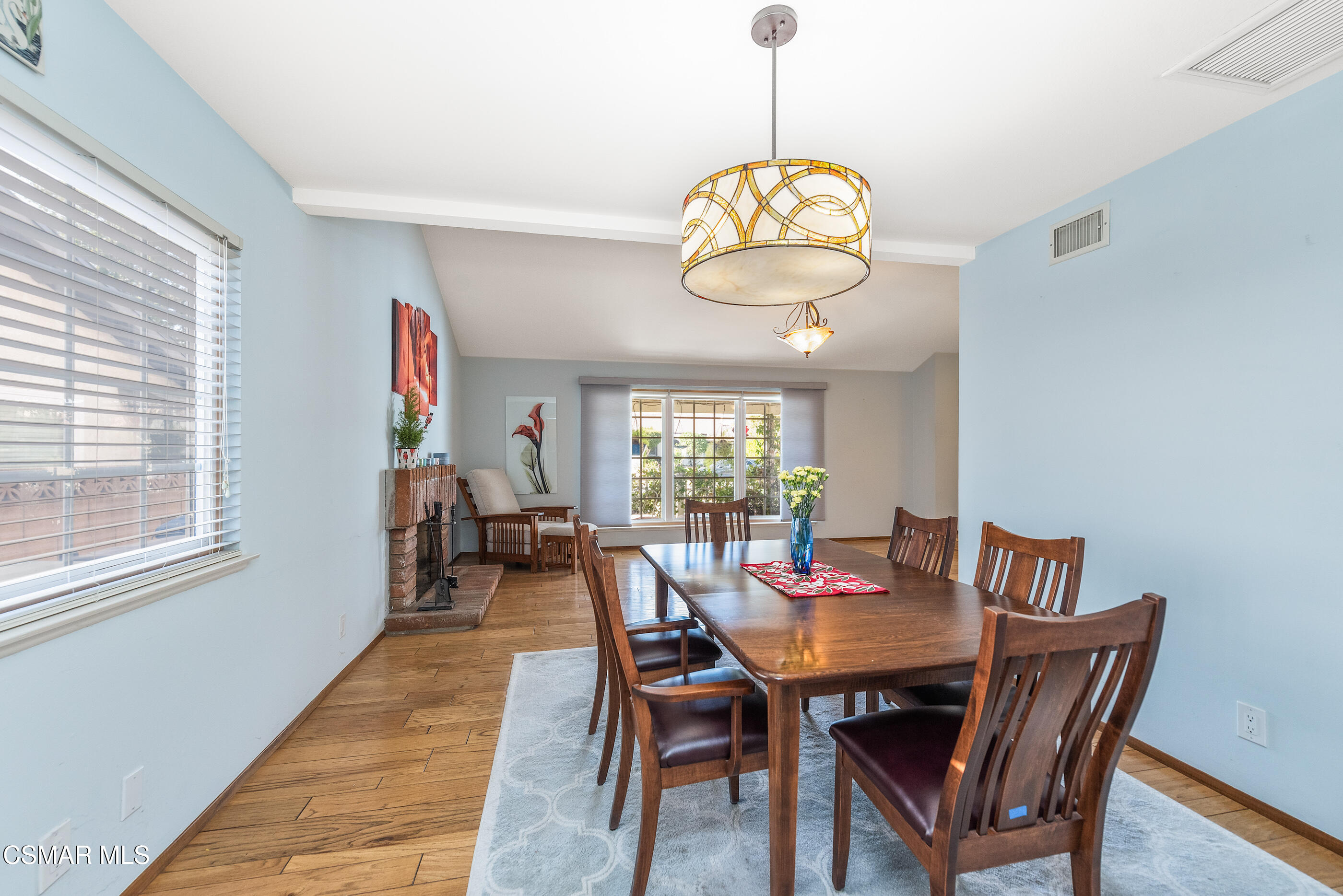 2226 Ecroyd Avenue Simi Valley, CA 93063 - Photo 15 of 52 a view of a dining room with furniture wooden floor and chandelier