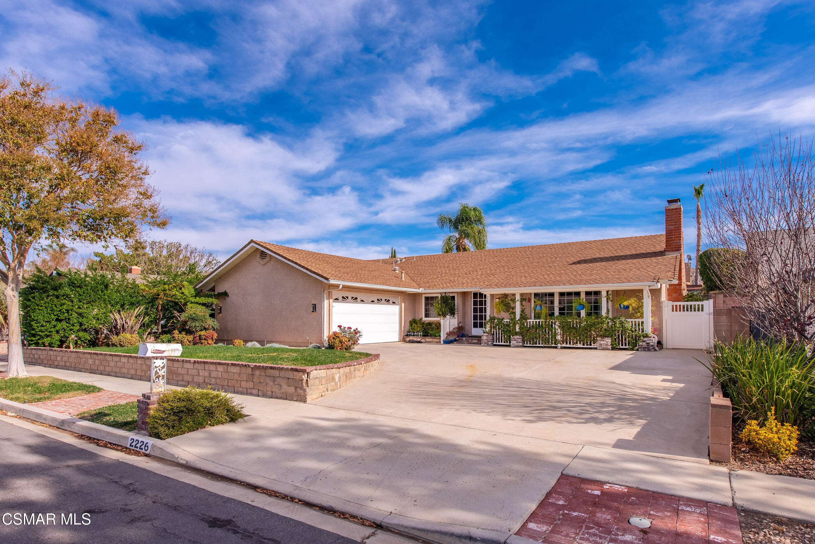 2226 Ecroyd Avenue Simi Valley, CA 93063 - Photo 2 of 52 a front view of a house with a yard and potted plants