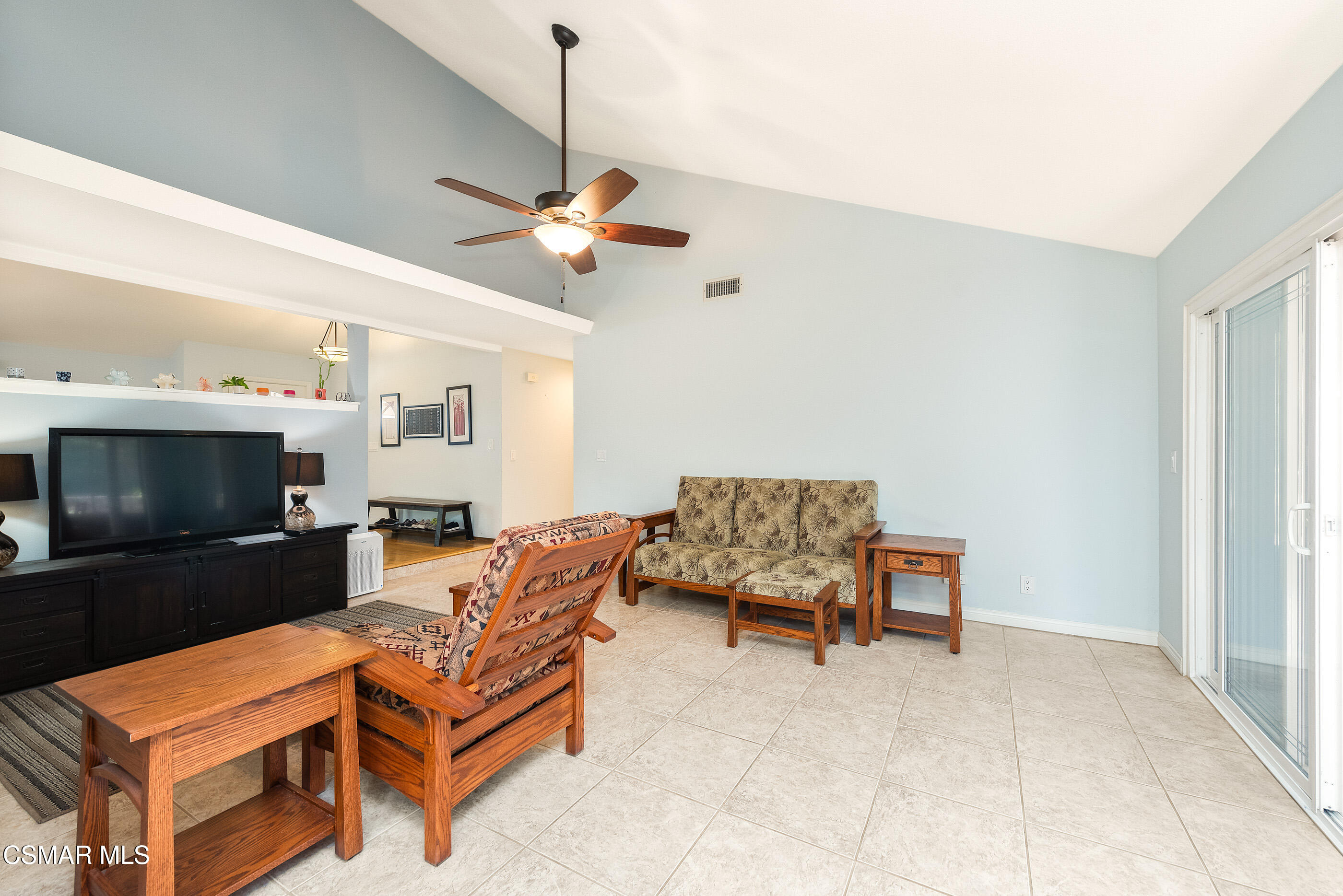 2226 Ecroyd Avenue Simi Valley, CA 93063 - Photo 22 of 52 a living room with furniture a flat screen tv and kitchen view