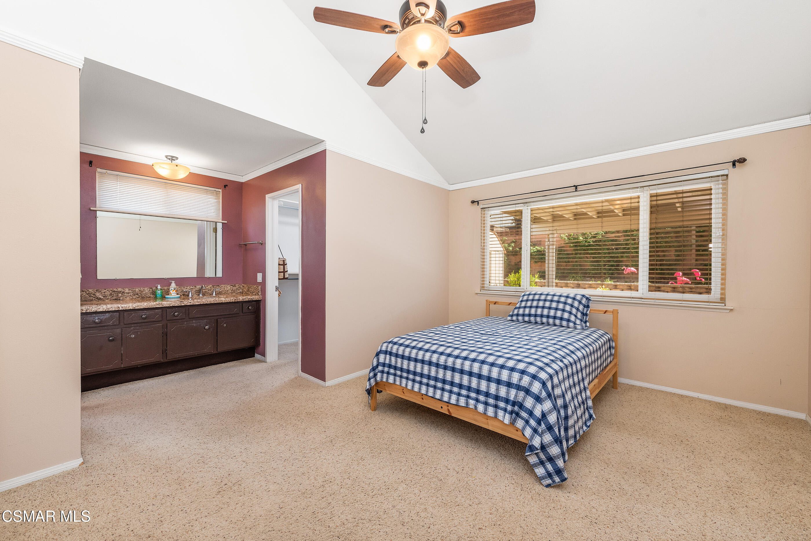 2226 Ecroyd Avenue Simi Valley, CA 93063 - Photo 29 of 52 a spacious bedroom with a bed and a chandelier