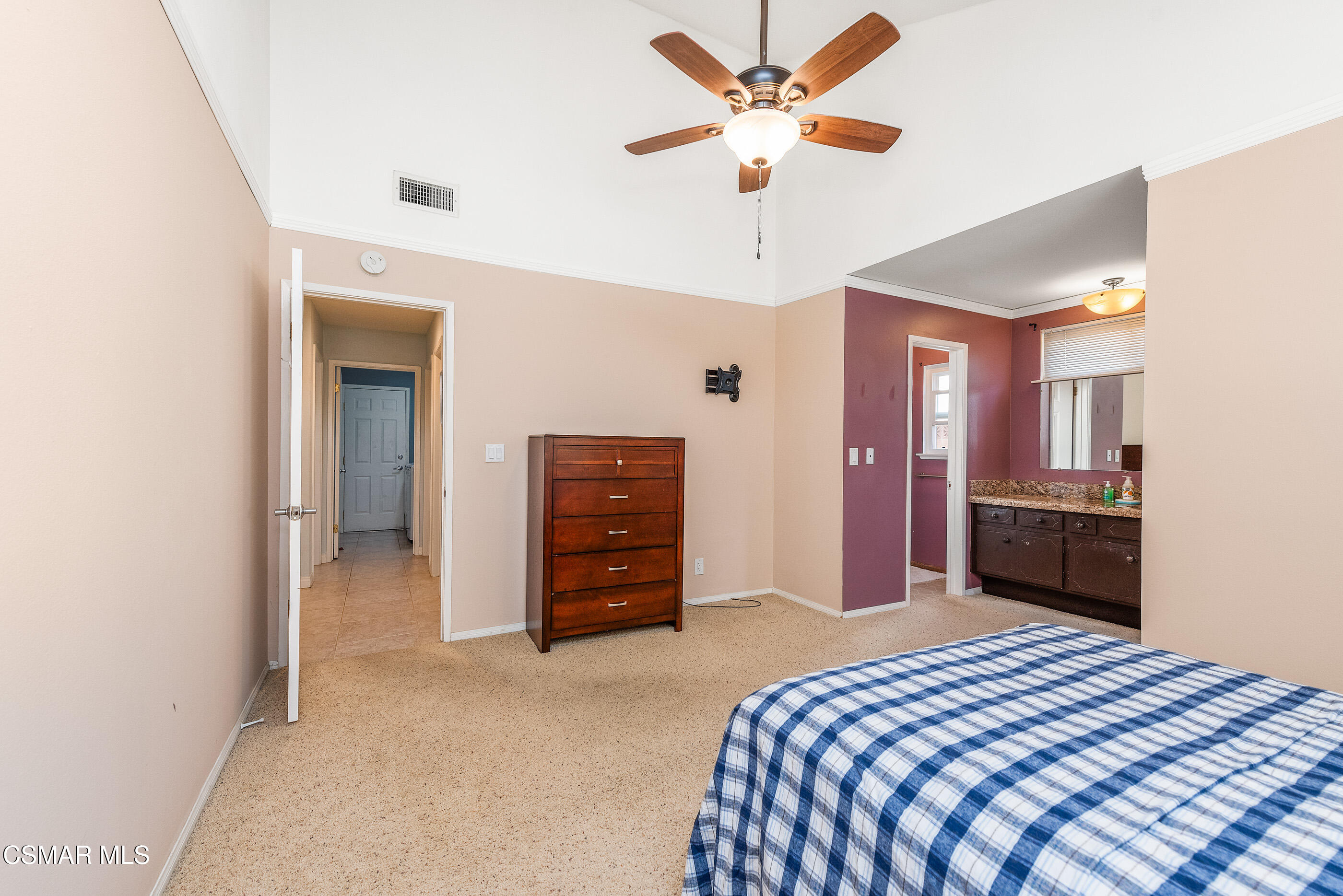 2226 Ecroyd Avenue Simi Valley, CA 93063 - Photo 30 of 52 a bedroom with a bed and a chandelier