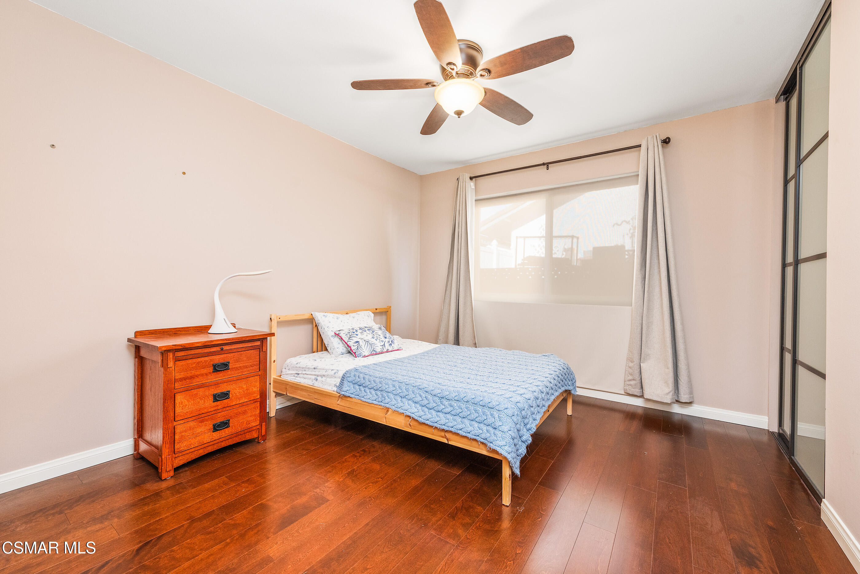 2226 Ecroyd Avenue Simi Valley, CA 93063 - Photo 35 of 52 a bedroom with a bed and wooden floor