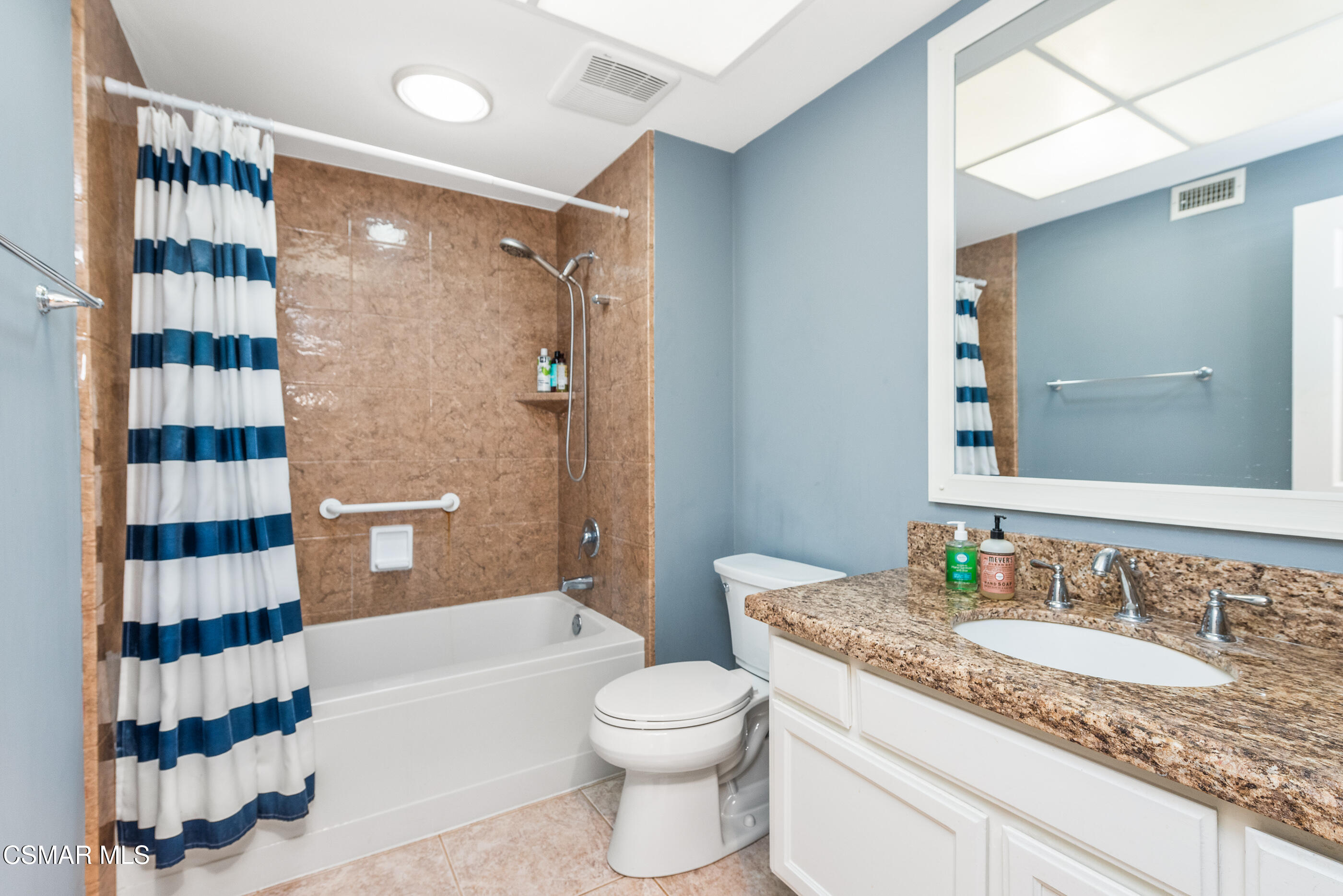 2226 Ecroyd Avenue Simi Valley, CA 93063 - Photo 38 of 52 a bathroom with a granite countertop sink a toilet a shower and a mirror