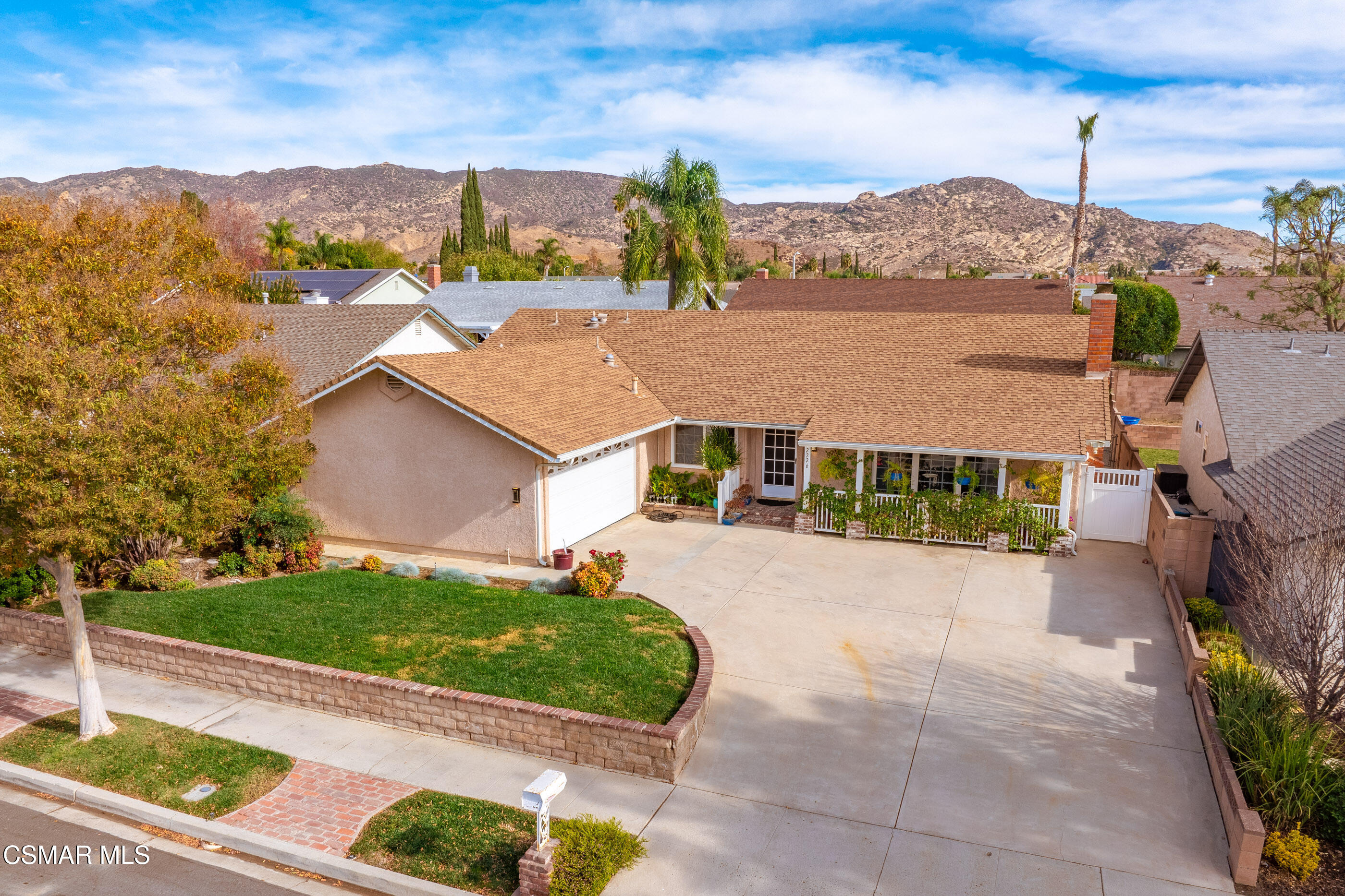2226 Ecroyd Avenue Simi Valley, CA 93063 - Photo 45 of 52 a view of a white house with a yard and potted plants