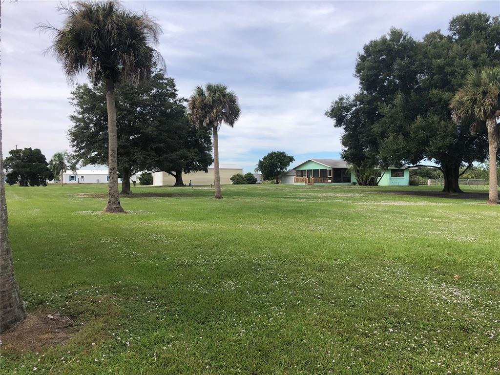 1454 Ted Beck Road Moore Haven, FL 33471 - Photo 1 of 1 a view of a trees in a park