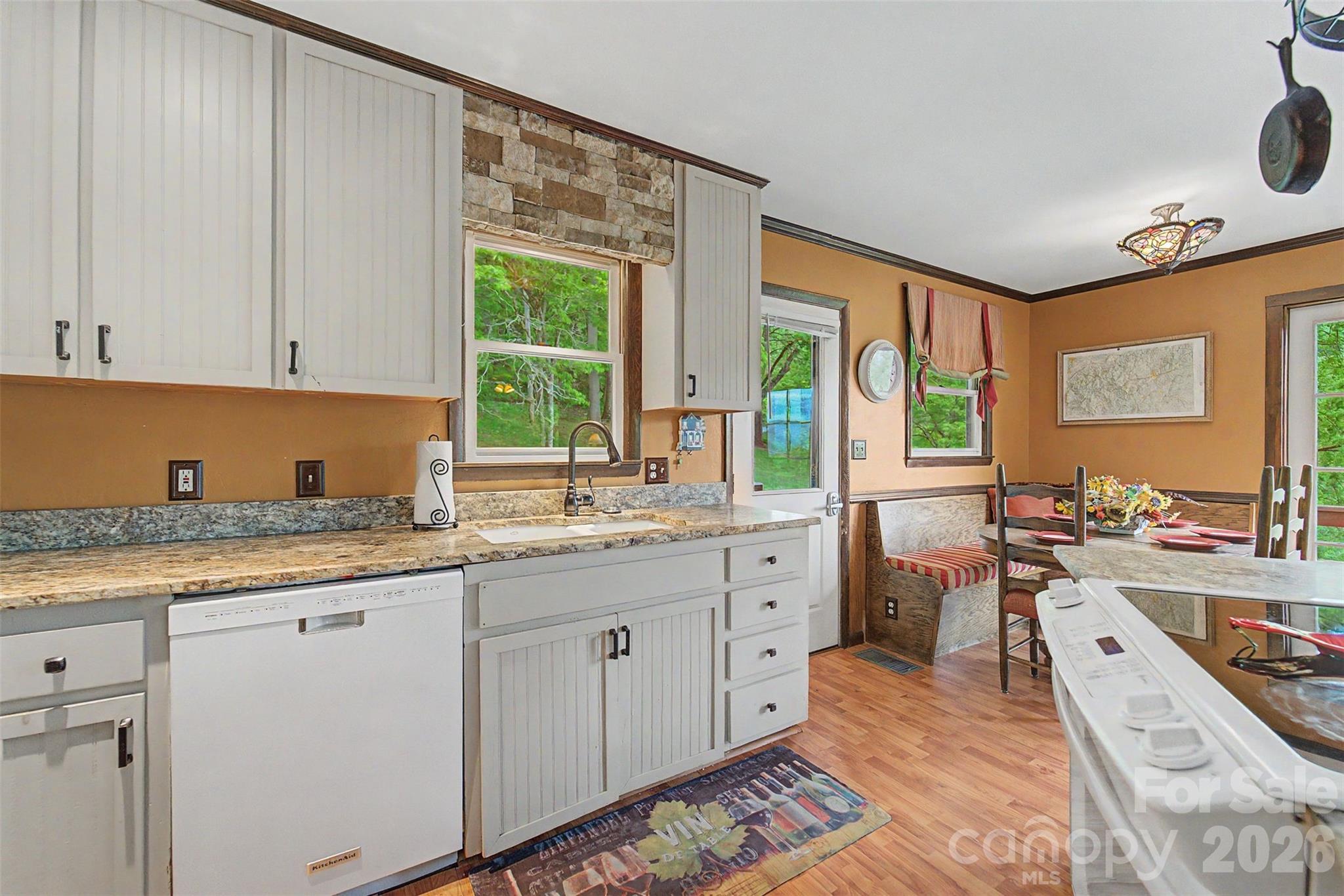 1413 Kitchens Branch Road Sylva, NC 28779 - Photo 11 of 46 a kitchen that has a sink and a stove in it