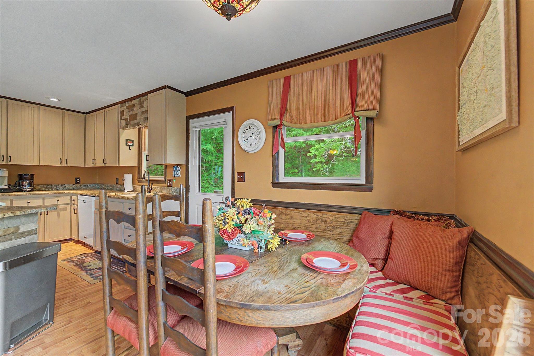1413 Kitchens Branch Road Sylva, NC 28779 - Photo 13 of 46 a view of a dining room with furniture and a window
