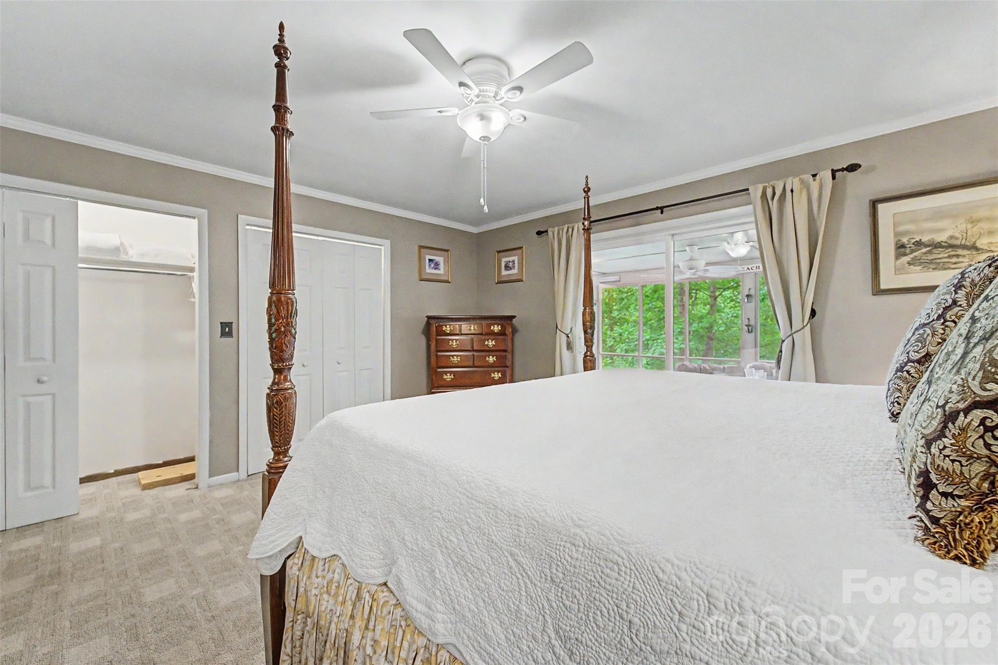 1413 Kitchens Branch Road Sylva, NC 28779 - Photo 17 of 46 a spacious bedroom with a large bed closet and a window