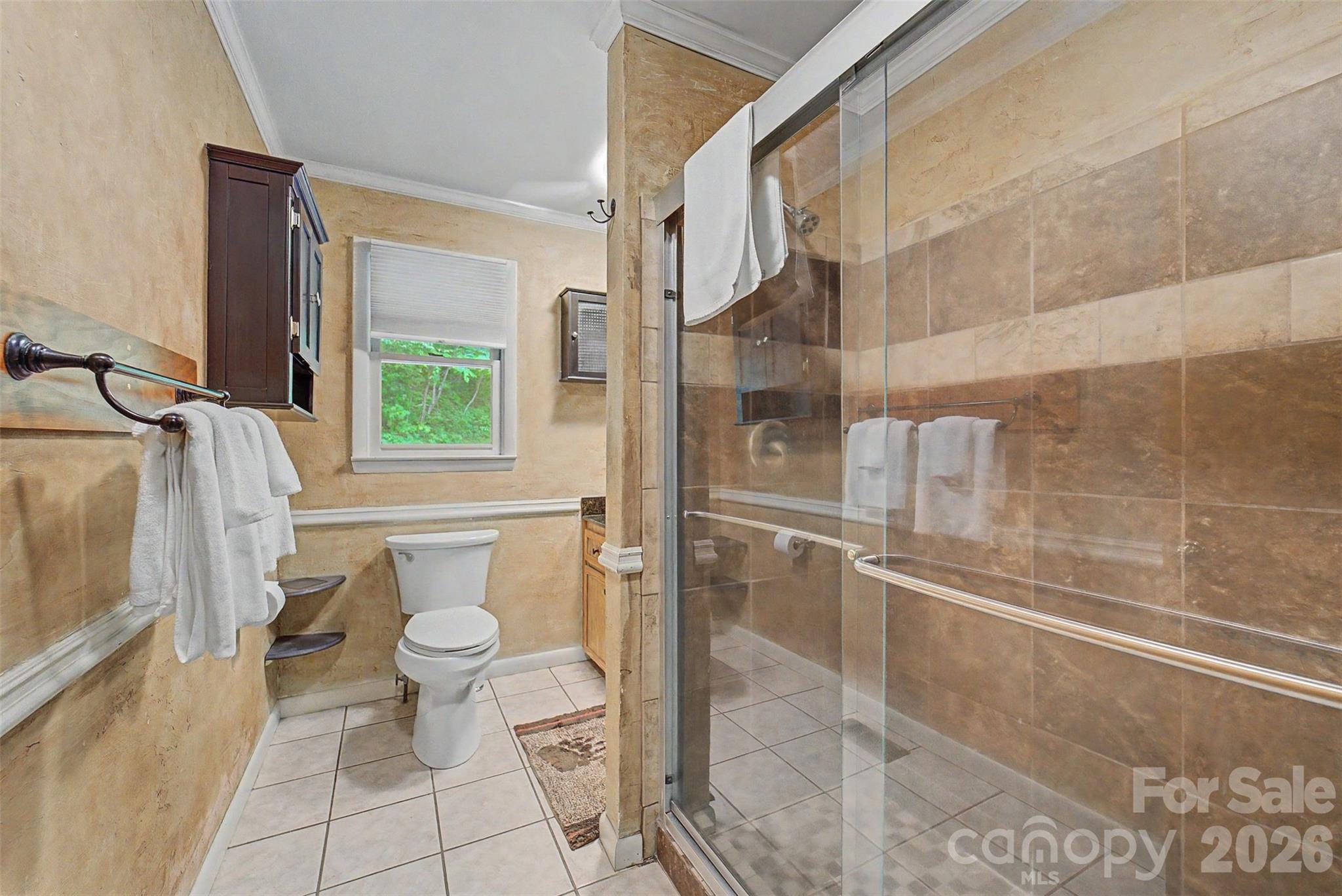 1413 Kitchens Branch Road Sylva, NC 28779 - Photo 18 of 46 a bathroom with a toilet and a shower
