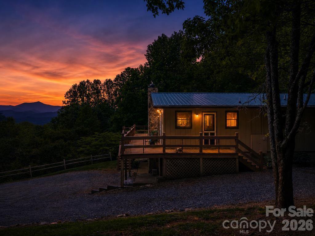 1413 Kitchens Branch Road Sylva, NC 28779 - Photo 2 of 46 a view of a bench in a yard