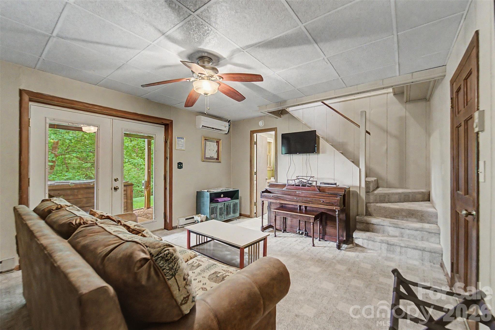 1413 Kitchens Branch Road Sylva, NC 28779 - Photo 21 of 46 a living room with furniture and a large window