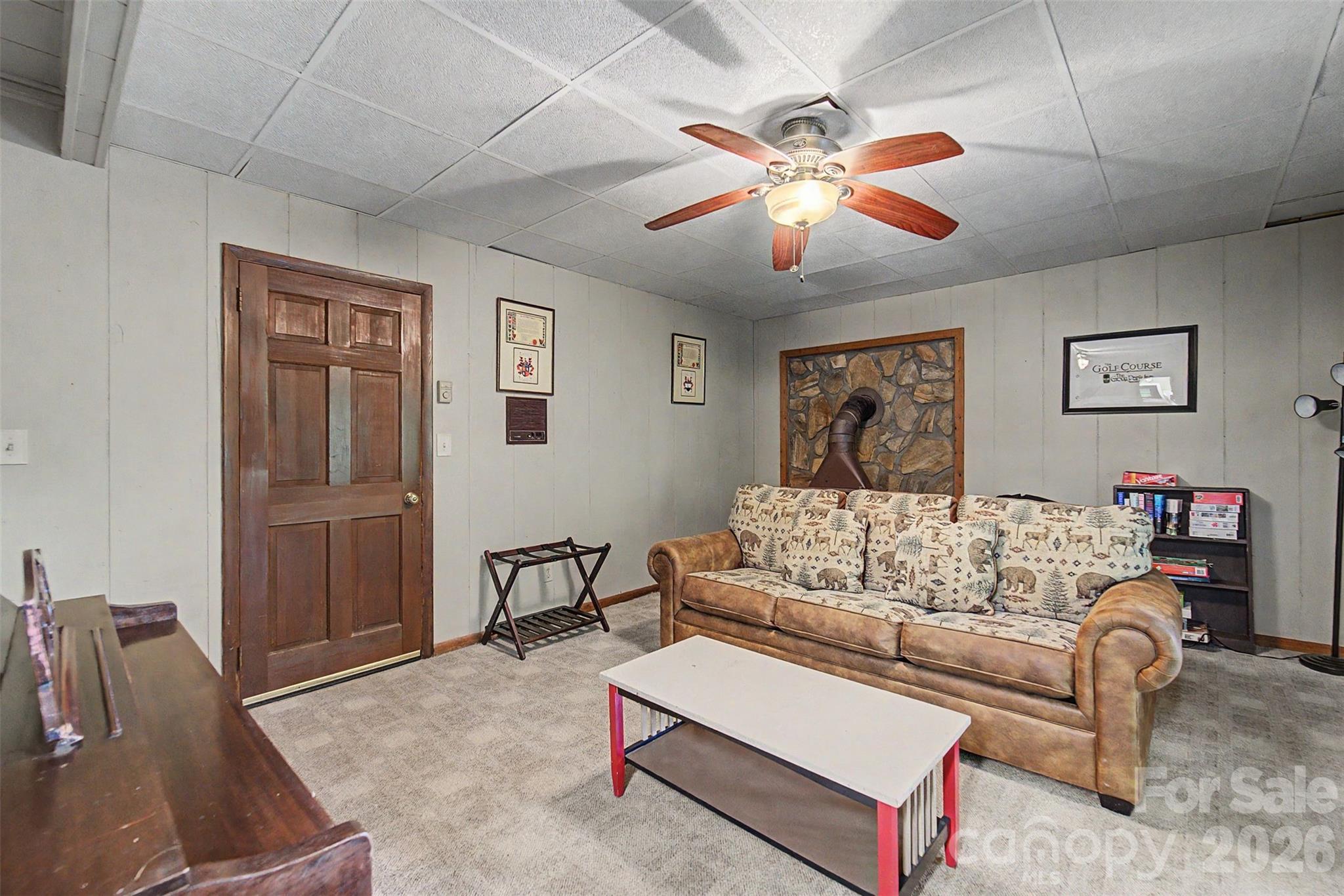 1413 Kitchens Branch Road Sylva, NC 28779 - Photo 22 of 46 a living room with furniture and a flat screen tv