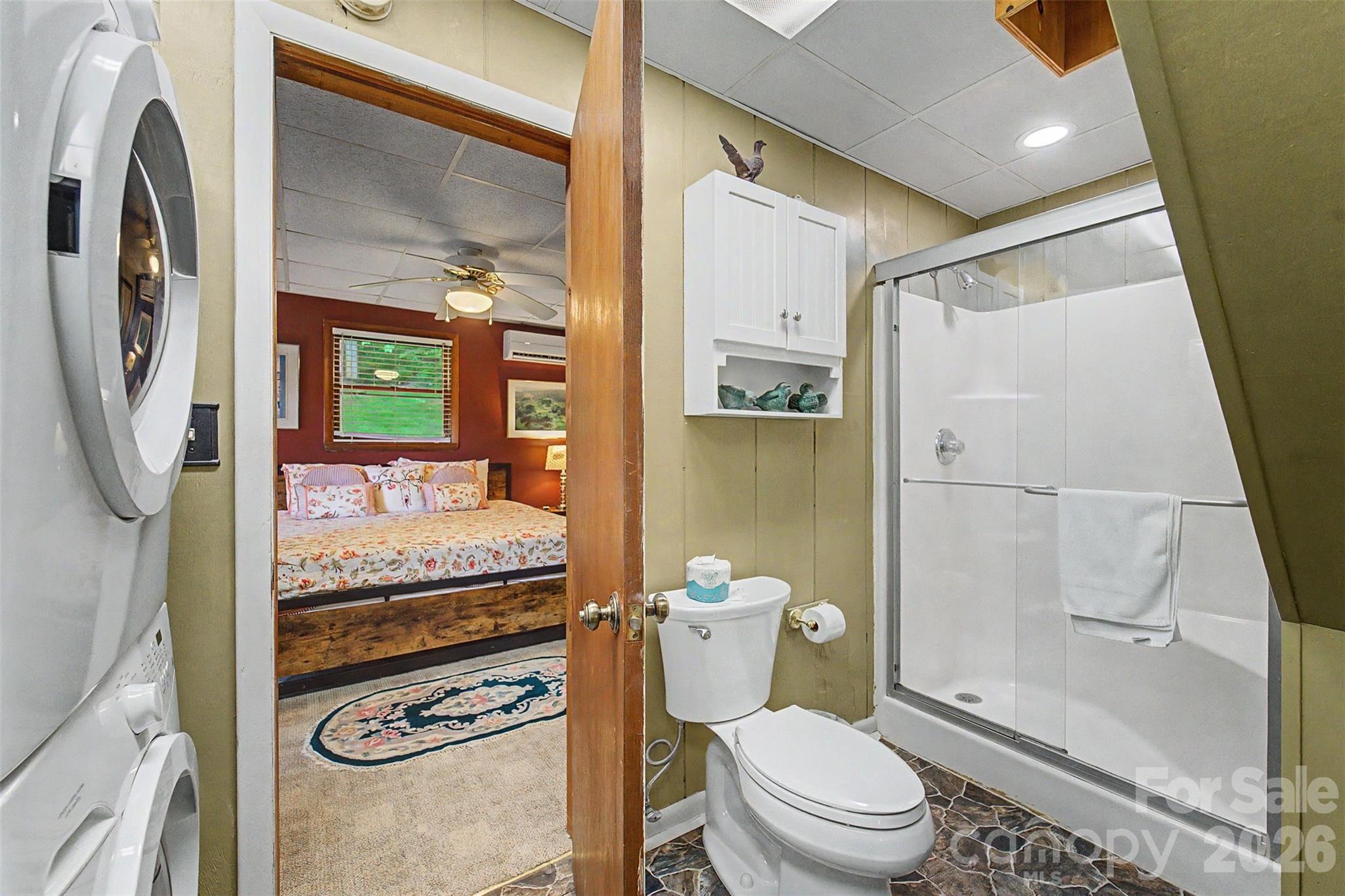 1413 Kitchens Branch Road Sylva, NC 28779 - Photo 23 of 46 a bathroom with a granite countertop sink mirror vanity and toilet