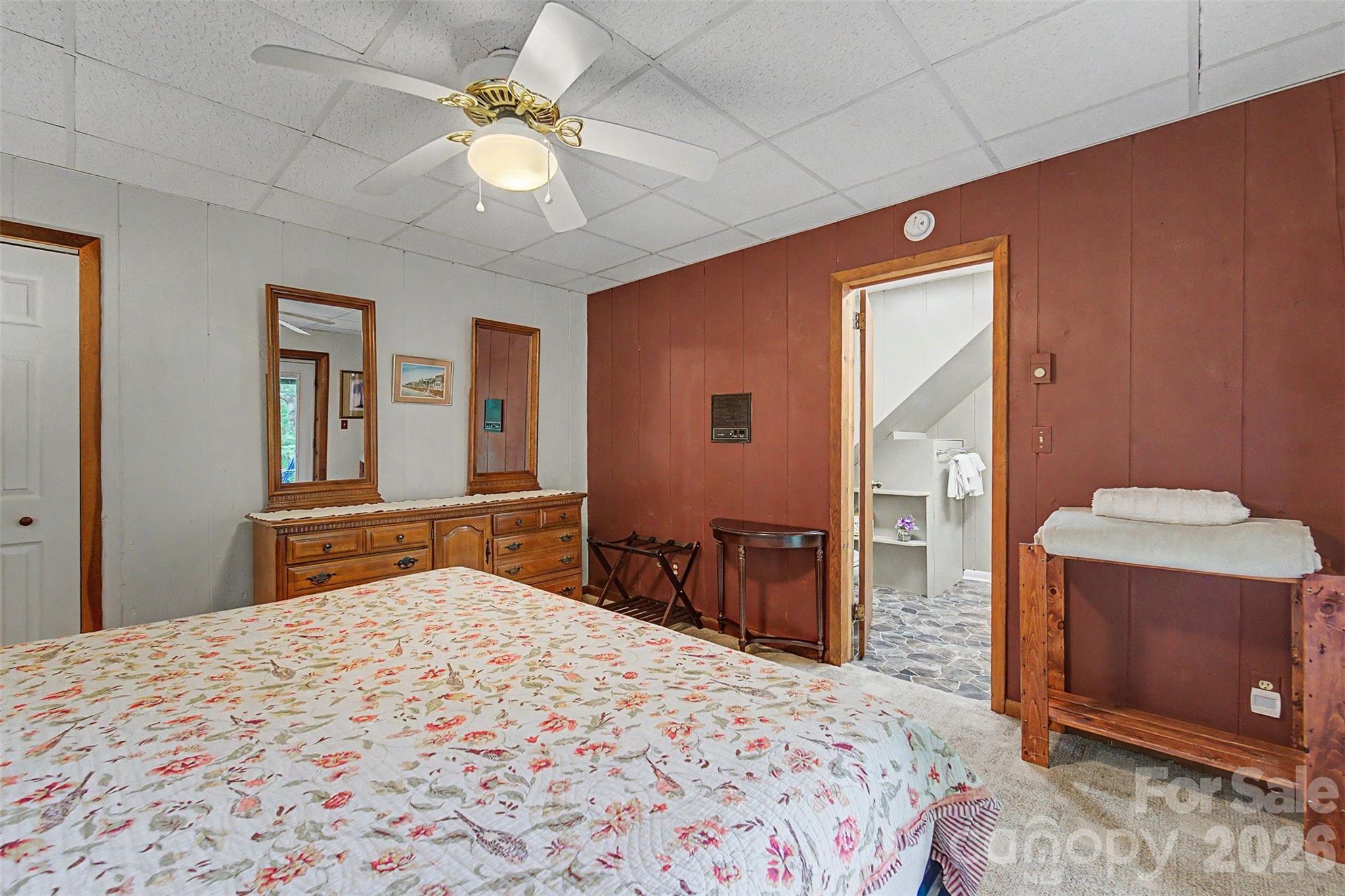 1413 Kitchens Branch Road Sylva, NC 28779 - Photo 26 of 46 a bedroom with a bed and a dresser