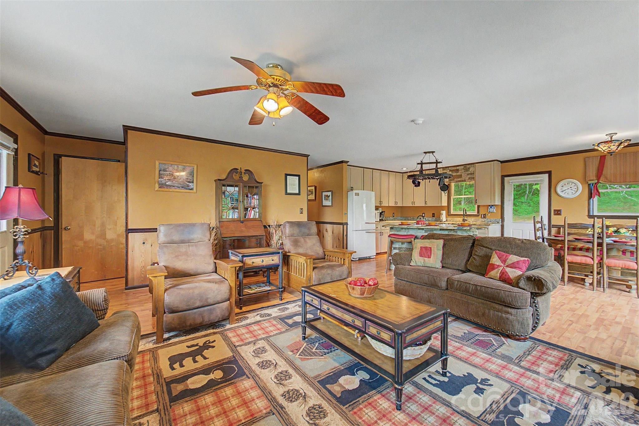 1413 Kitchens Branch Road Sylva, NC 28779 - Photo 8 of 46 a living room with furniture kitchen view and large windows