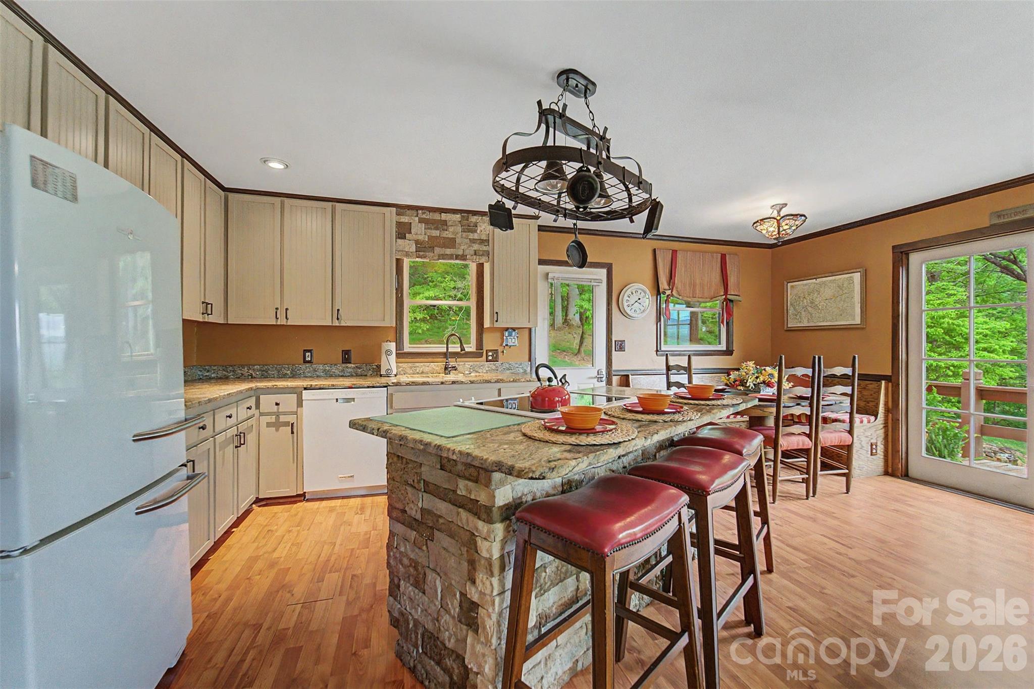 1413 Kitchens Branch Road Sylva, NC 28779 - Photo 10 of 46 a view of a dining room with furniture window and wooden floor