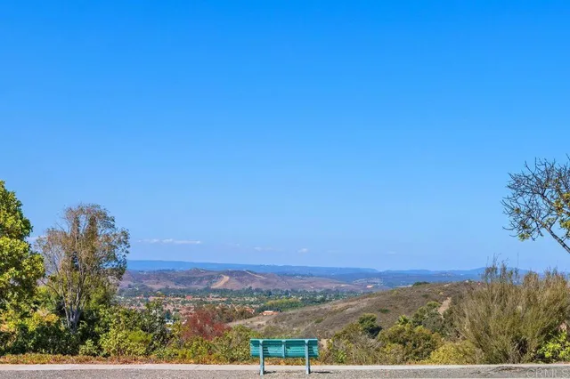 a outdoor living room with furniture and a window