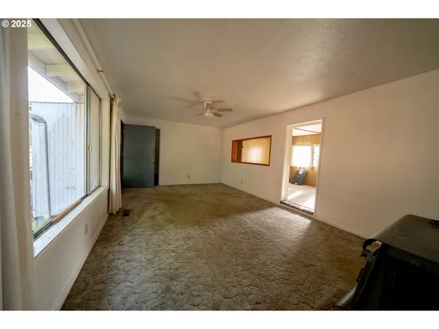 a view of empty room with windows