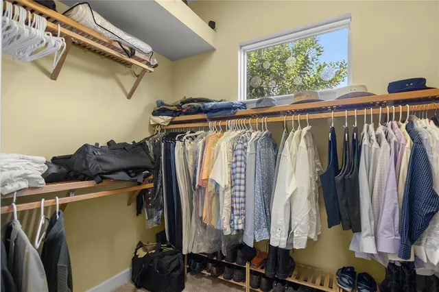 a bathroom with a granite countertop sink mirror and double