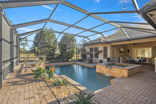 a view of a swimming pool with a patio
