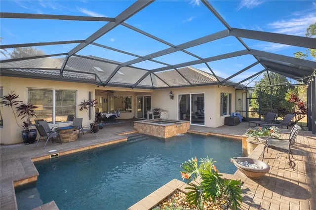 a view of a swimming pool with a patio