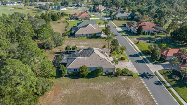 an aerial view of house with yard swimming pool and outdoor seating