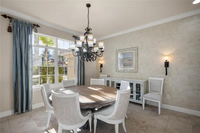 a kitchen with a dining table and chairs