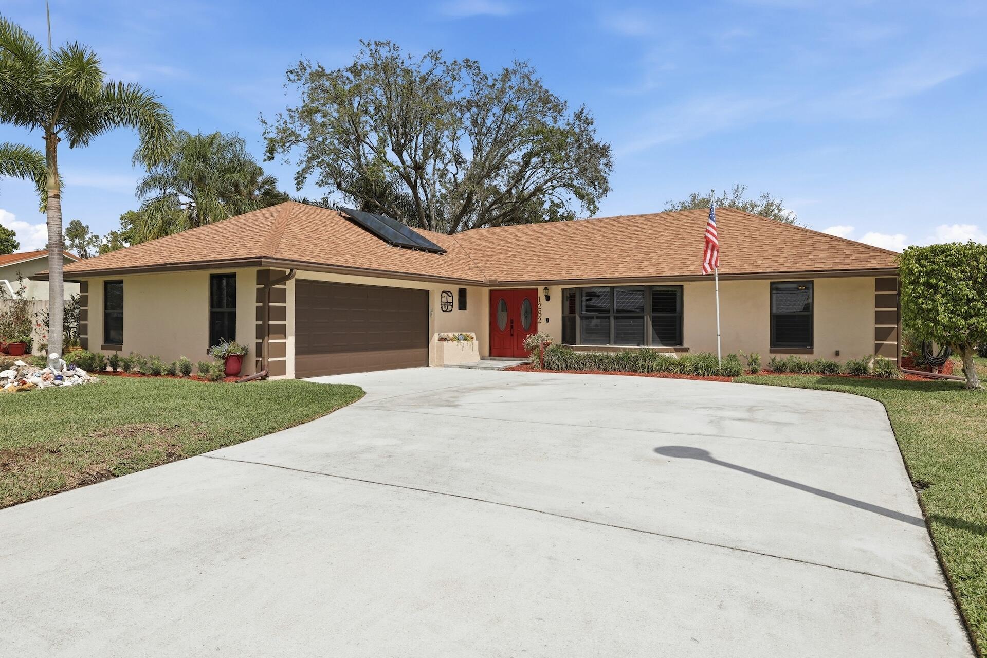 1282 Whimbrel Road Wellington, FL 33414 - Photo 1 of 23 0H8A6522