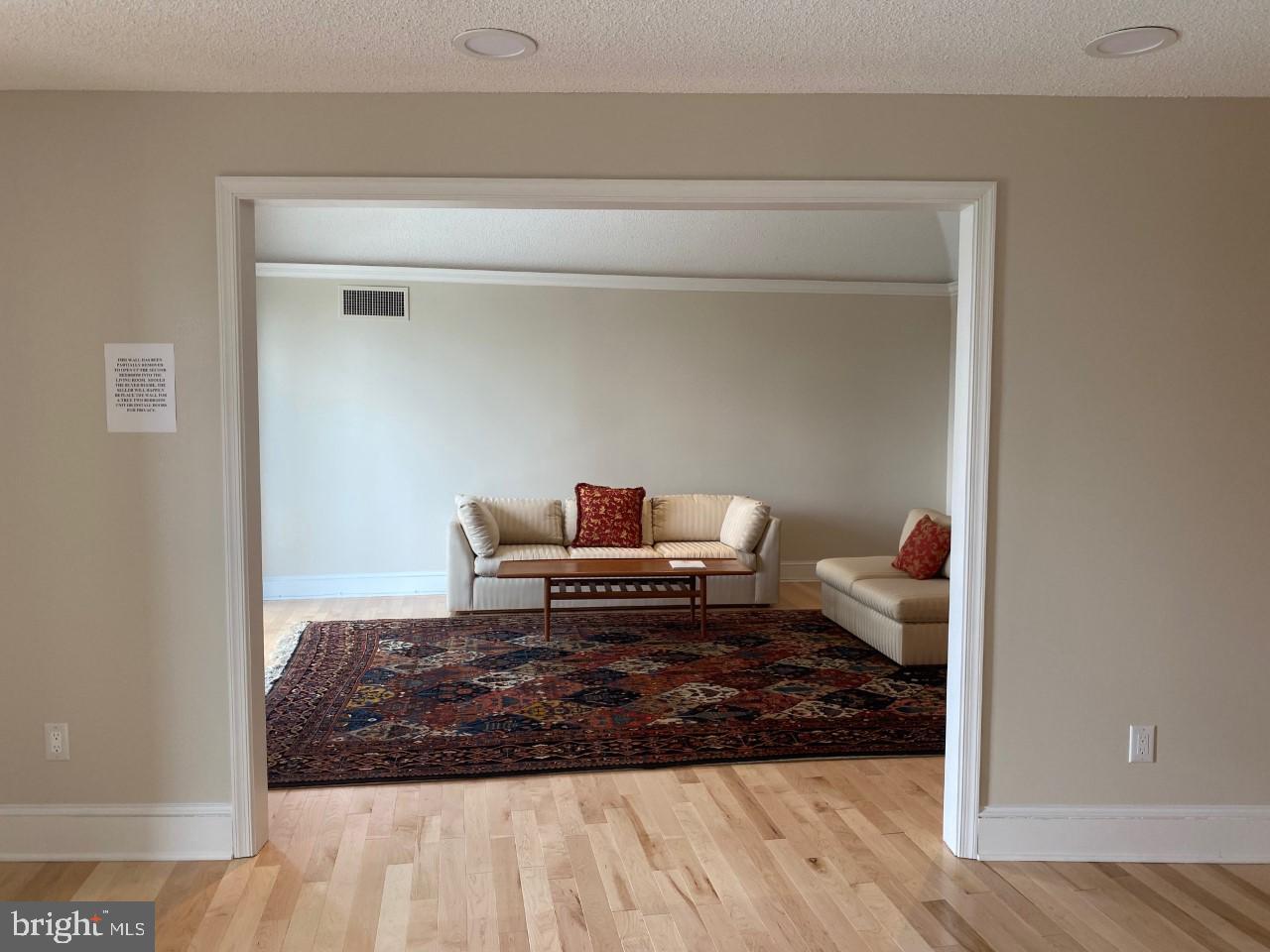 1101 South Arlington Ridge Road, Unit 105 Arlington, VA 22202 - Photo 53 of 80 Current Photo Of Open Wall Into Living Room