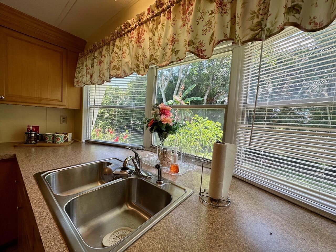 8070 South Street Boca Raton, FL 33433 - Photo 15 of 35 a kitchen with a sink and a refrigerator