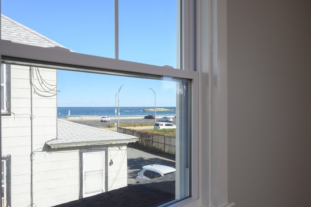 6 Atherton Road, Unit 2 Hull, MA 02045 - Photo 11 of 24 a kitchen with a window a sink and a refrigerator