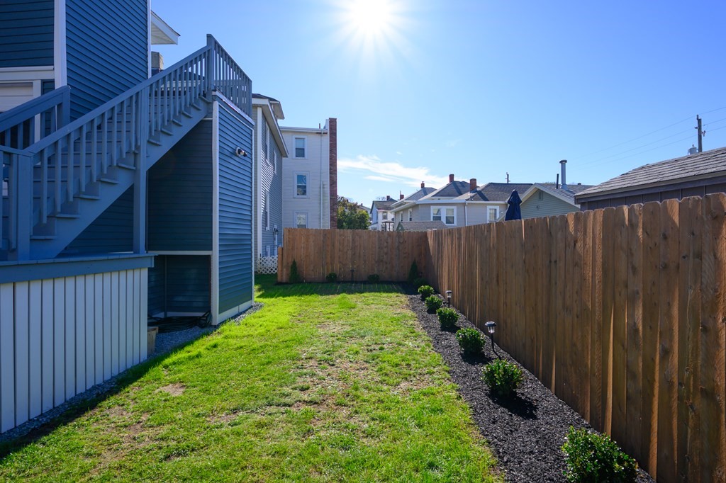 6 Atherton Road, Unit 2 Hull, MA 02045 - Photo 20 of 24 a view of a backyard with wooden fence