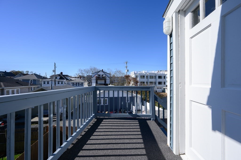 6 Atherton Road, Unit 2 Hull, MA 02045 - Photo 3 of 24 a view of a balcony with wooden floor