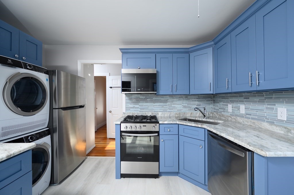 6 Atherton Road, Unit 2 Hull, MA 02045 - Photo 4 of 24 a kitchen with a sink and a stove top oven