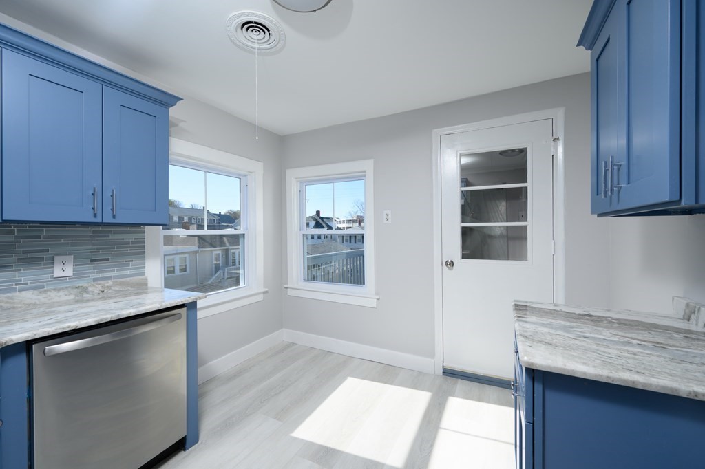 6 Atherton Road, Unit 2 Hull, MA 02045 - Photo 9 of 24 a kitchen with granite countertop cabinets appliances and a counter space