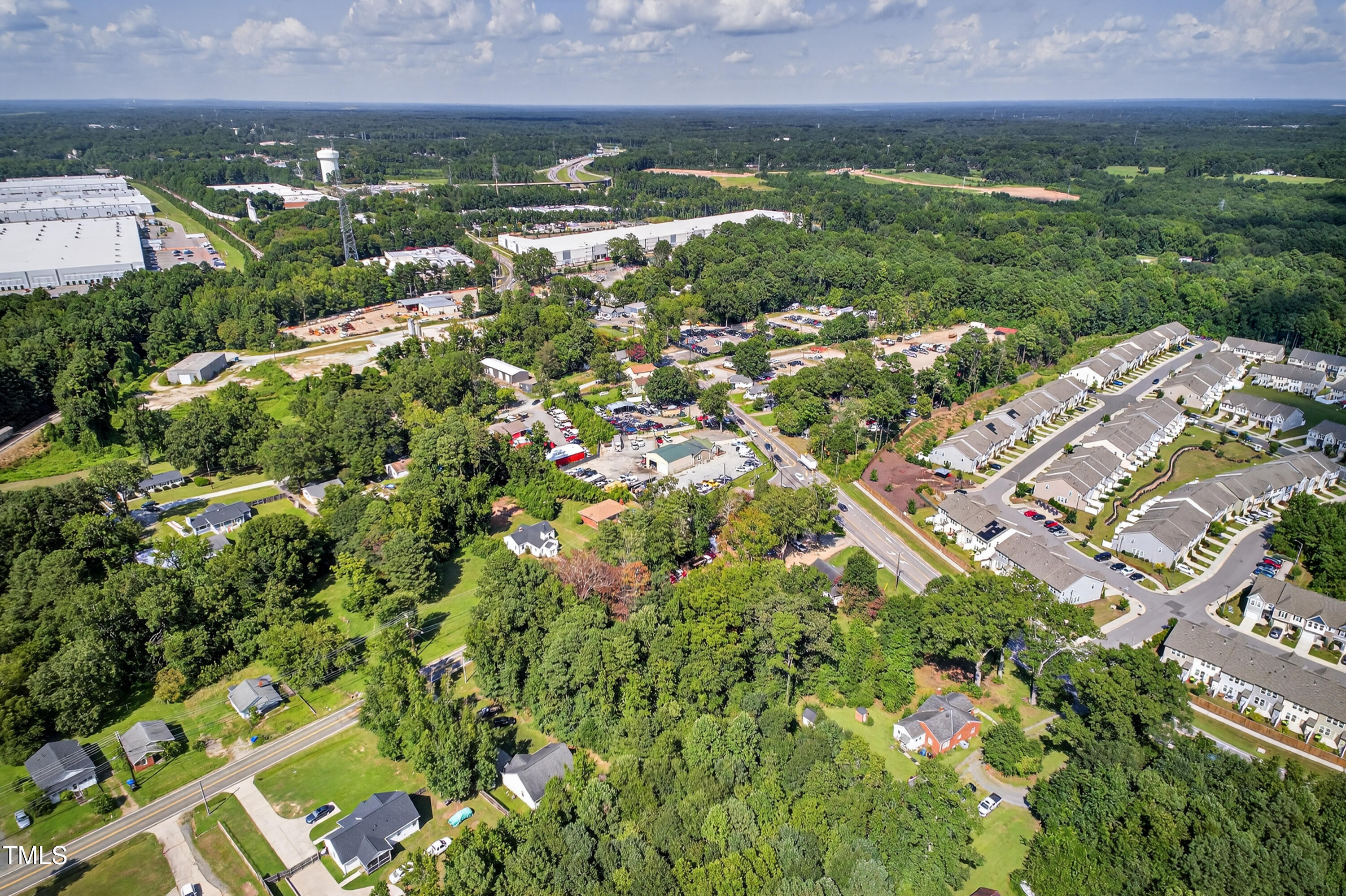 1202 Ellis Road Durham, NC 27703 - Photo 4 of 5 an aerial view of residential houses with outdoor space and trees