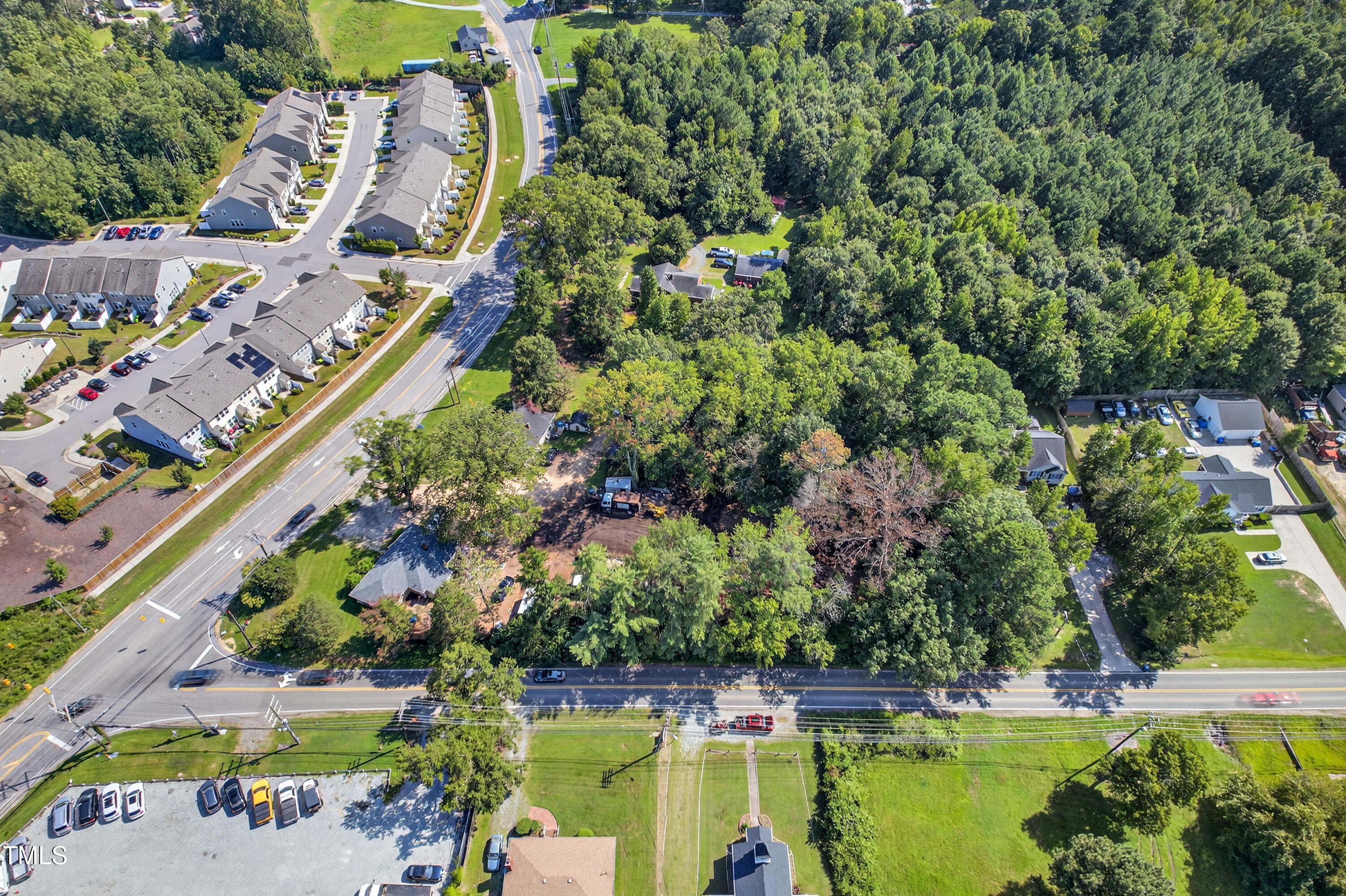 1202 Ellis Road Durham, NC 27703 - Photo 5 of 5 an aerial view of a swimming pool with lawn chairs and plants
