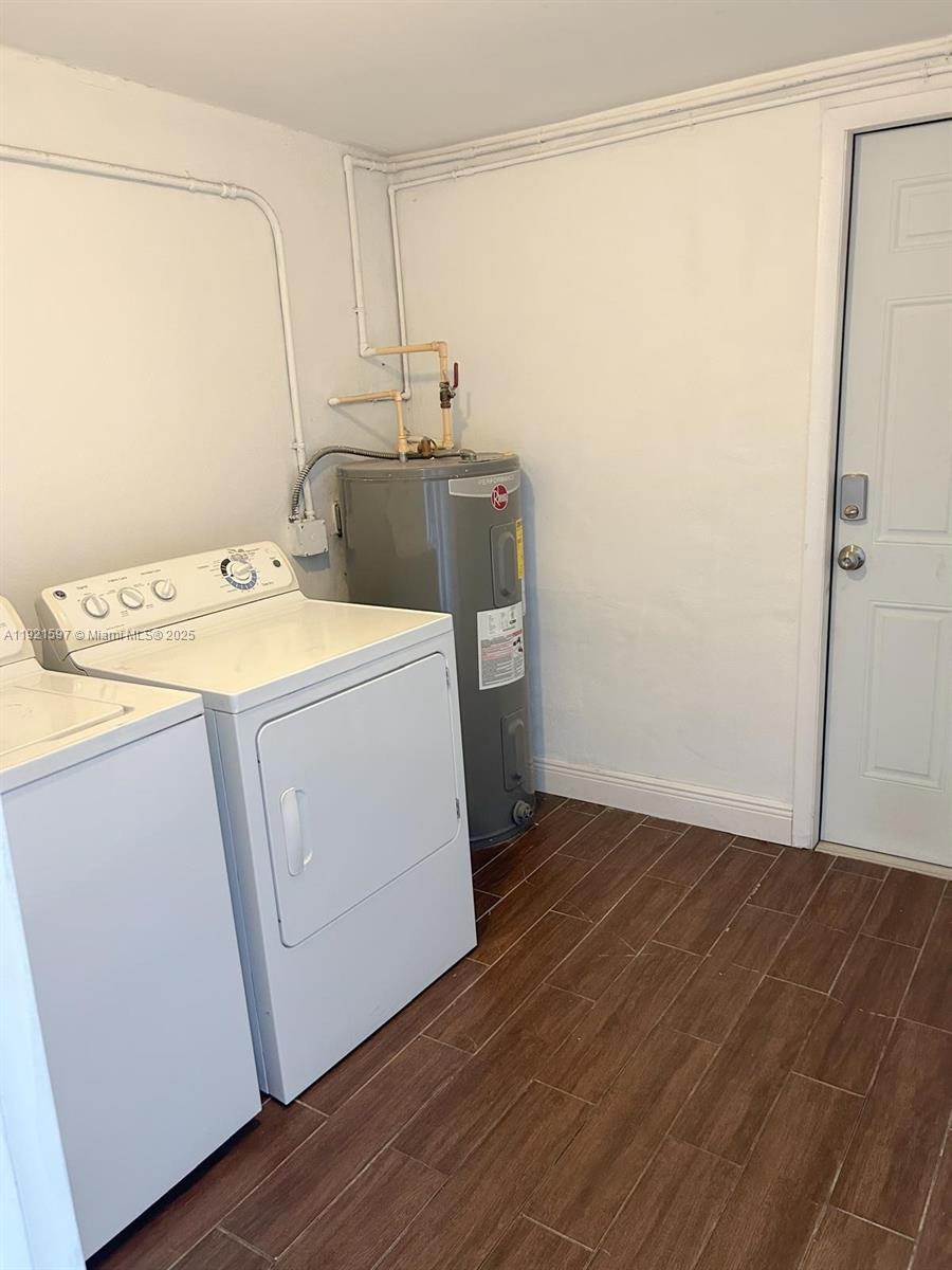 5790 Southwest 5th Street Miami, FL 33144 - Photo 15 of 31 a utility room with wooden floor washer and dryer