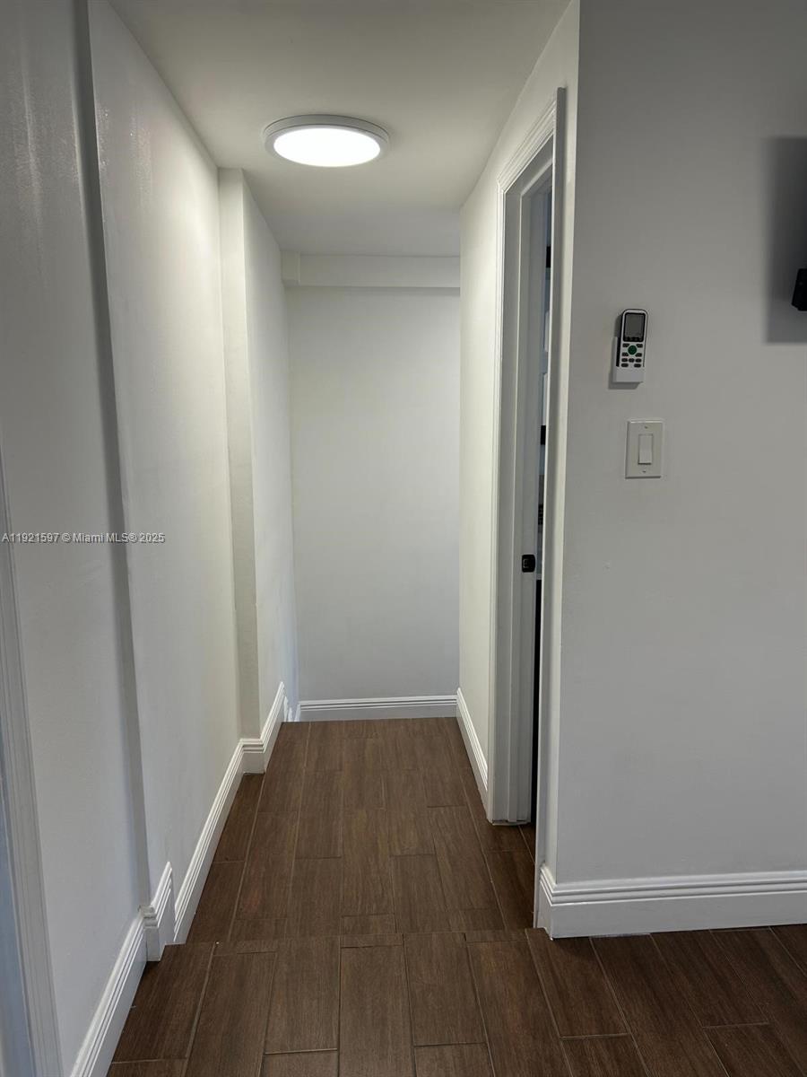 5790 Southwest 5th Street Miami, FL 33144 - Photo 17 of 31 an empty room with wooden floor and closet