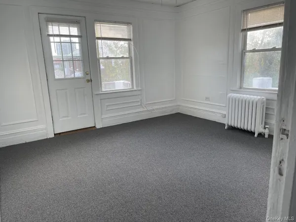 a bedroom with a bed and a fireplace