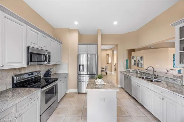 a view of a kitchen with kitchen island dining table and chair