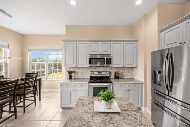 a dining room with furniture and windows